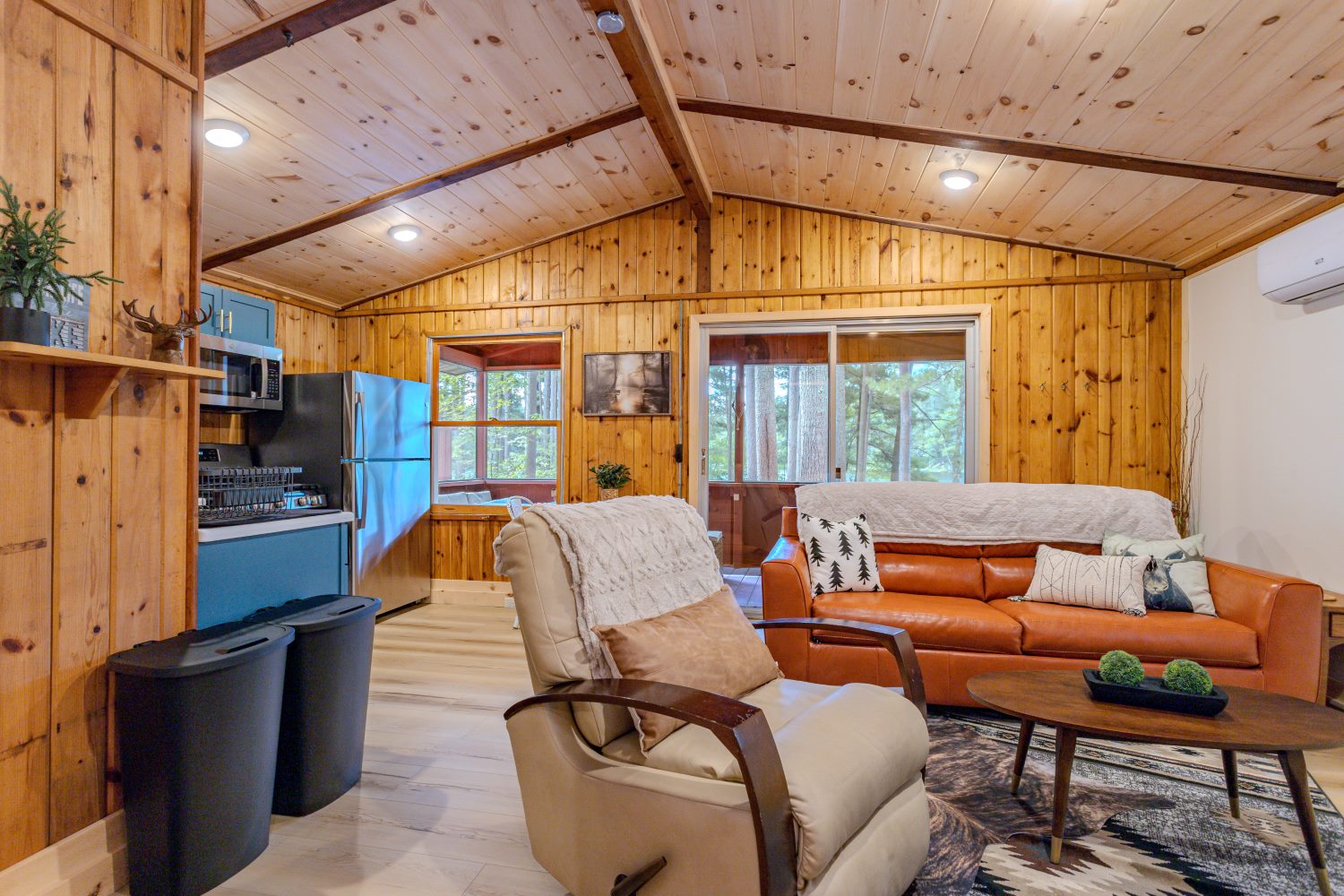 Knotty-pine living room with vaulted beam ceiling